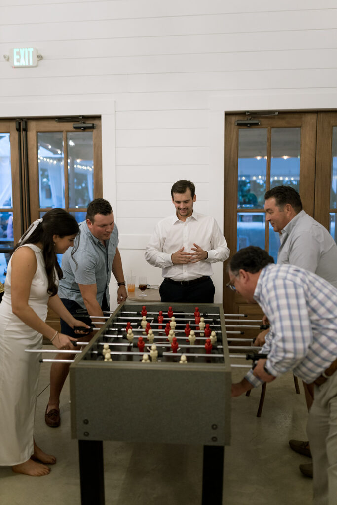 candid moments between guests during wedding rehearsal dinner