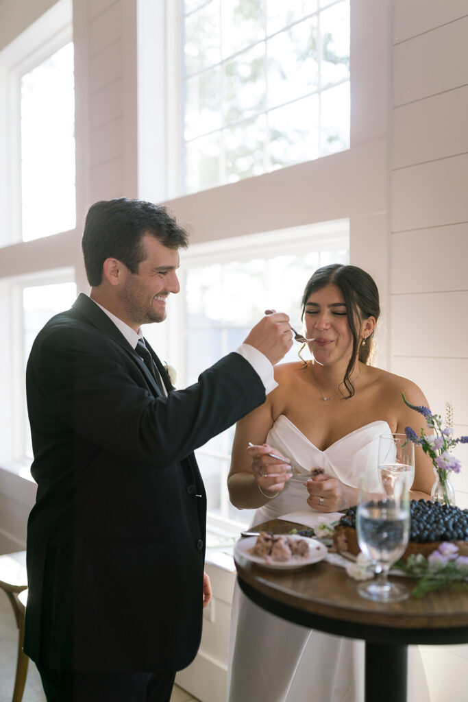 bride and groom cutting cake