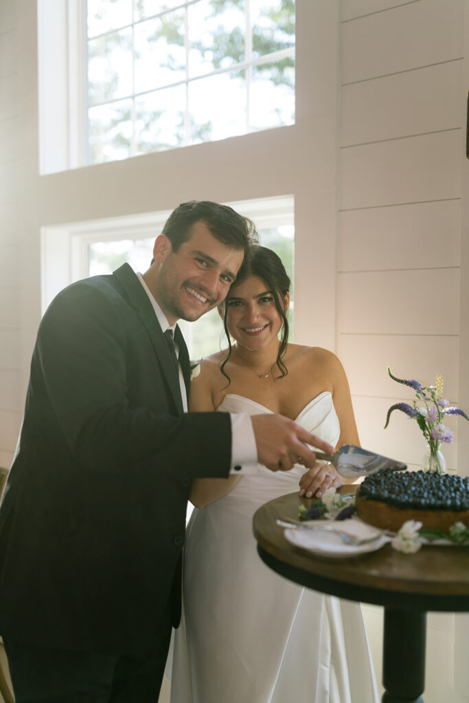 bride and groom cutting cake