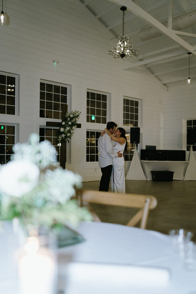 intimate wedding couple last dance in an empty wedding venue