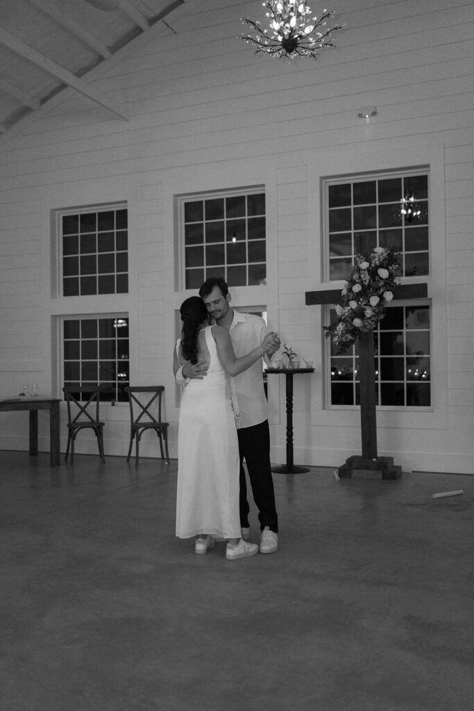 intimate wedding couple last dance in an empty wedding venue