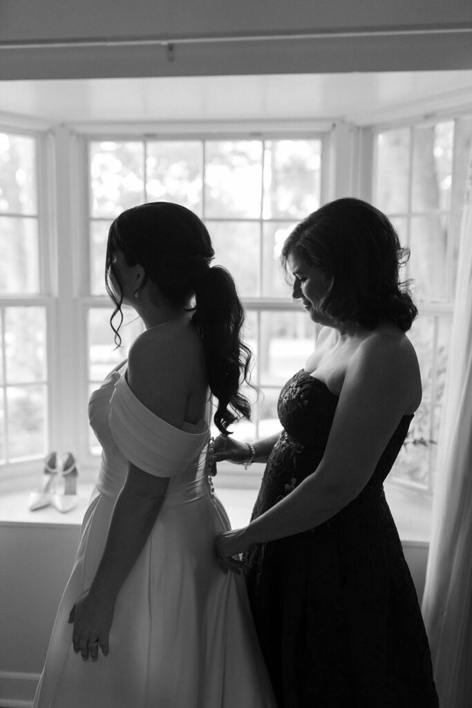 bride getting ready with her mom during a South Carolina wedding day