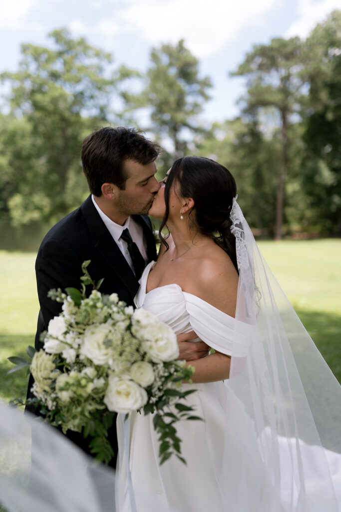 bride and groom walking around the Heron Hill property for their photos