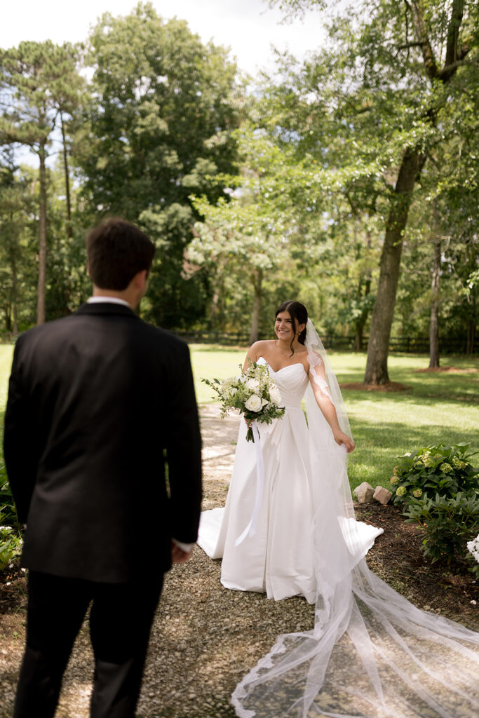 bride and groom walking around the Heron Hill property for their photos