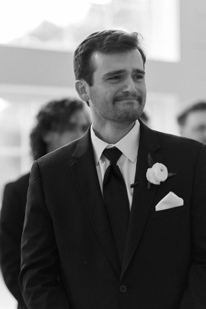 emotional groom at the altar during the ceremony