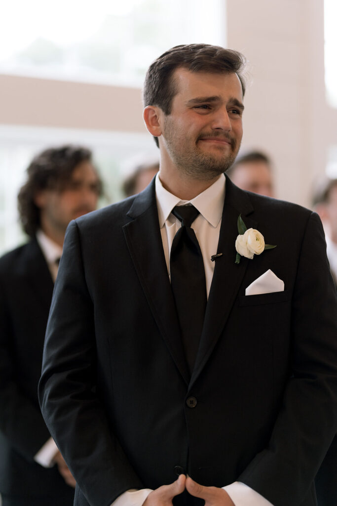 emotional groom at the altar during the ceremony