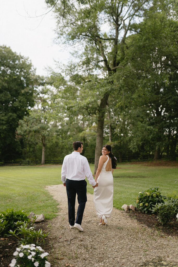 bride and groom wedding rehearsal portraits in greenery