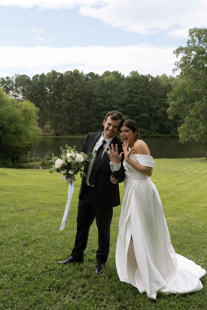 bride and groom walking around the Heron Hill property for their photos