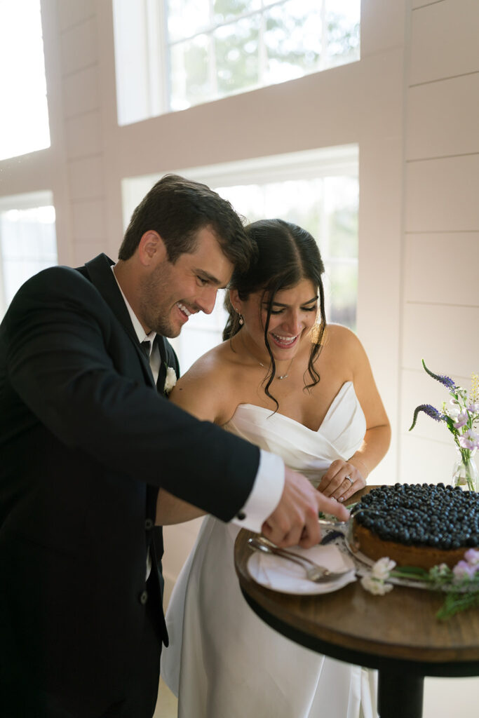 bride and groom cutting cake